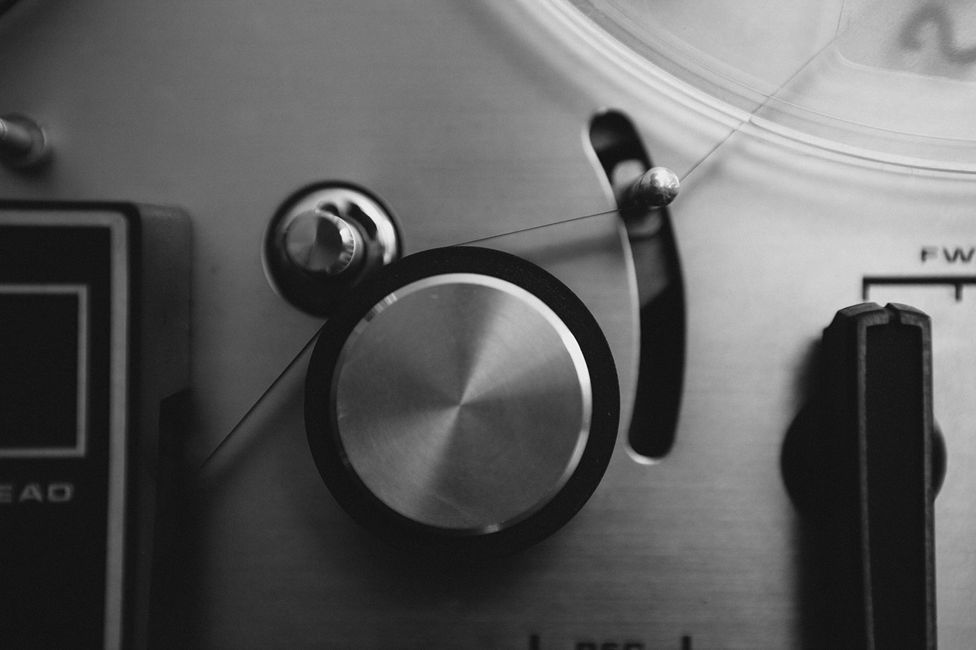 Black and white crop of a reel-to-reel player